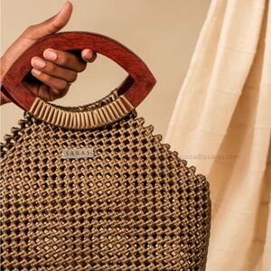 Saras Gold Kai Koodai  to toe bag  paired with wooden handles, super unique